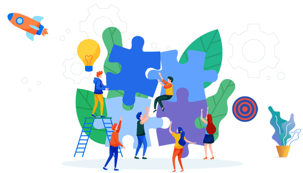 A group of people standing around puzzle pieces.