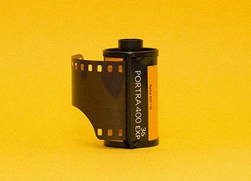 A roll of film is sitting on the table.