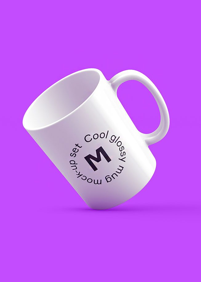 A coffee mug with the letter m on it.