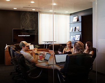 A group of people sitting around a table.
