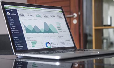 A laptop computer sitting on top of a desk.