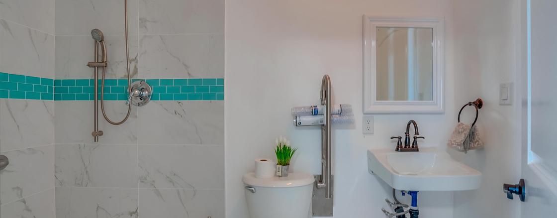 A bathroom with a toilet and sink in it