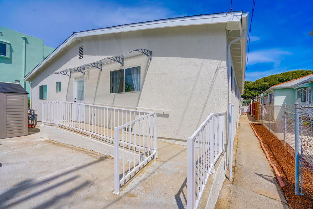 A white house with a blue sky in the background.