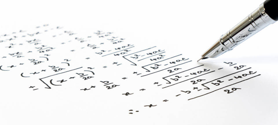 Mathematical equations written on paper.