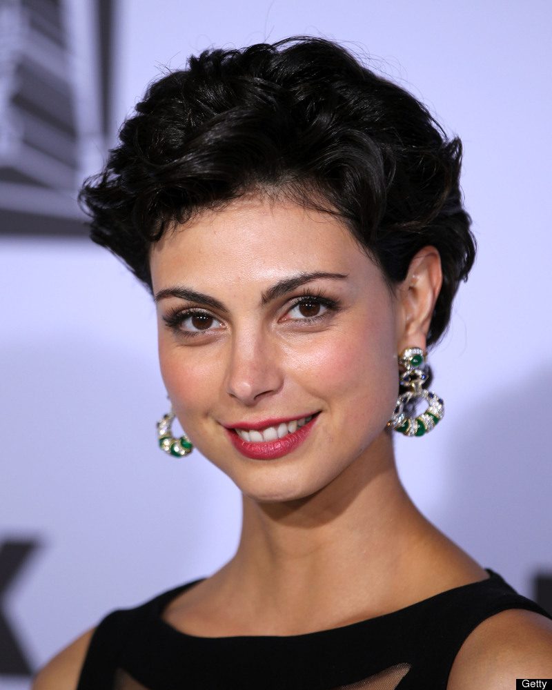 Smiling woman with short dark hair.