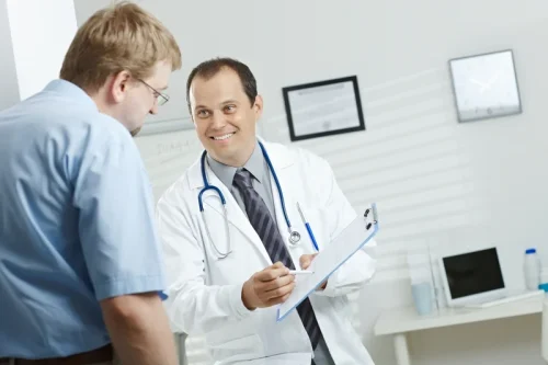 Doctor consulting with a patient in an office.